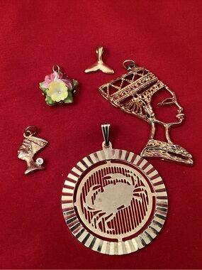 Multiples Gold-Tone Crab Cutout Pendant Necklace with Egyptian Profile Charms